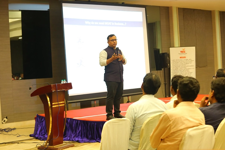 Business Owner Delivers Motivational Speech to Audience Confident business owner addressing an audience during a professional event sharing insights & experiences